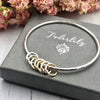 Sterling Bangle with 7 Mixed (Silver & Gold) Rings