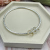 Sterling Silver Bangle with Silver & Gold Rings (3 to 9)