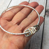 Sterling Bangle with 6 Mixed (Silver & Gold) Rings
