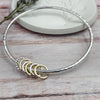 Sterling Bangle with 6 Mixed (Silver & Gold) Rings