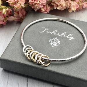 Sterling Bangle with 7 Mixed (Silver & Gold) Rings
