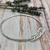 Sterling Silver Bangle with 8 Silver Rings